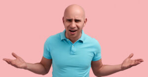 Bald man hands up Calling a male co-worker 'bald' can be sex-based harassment